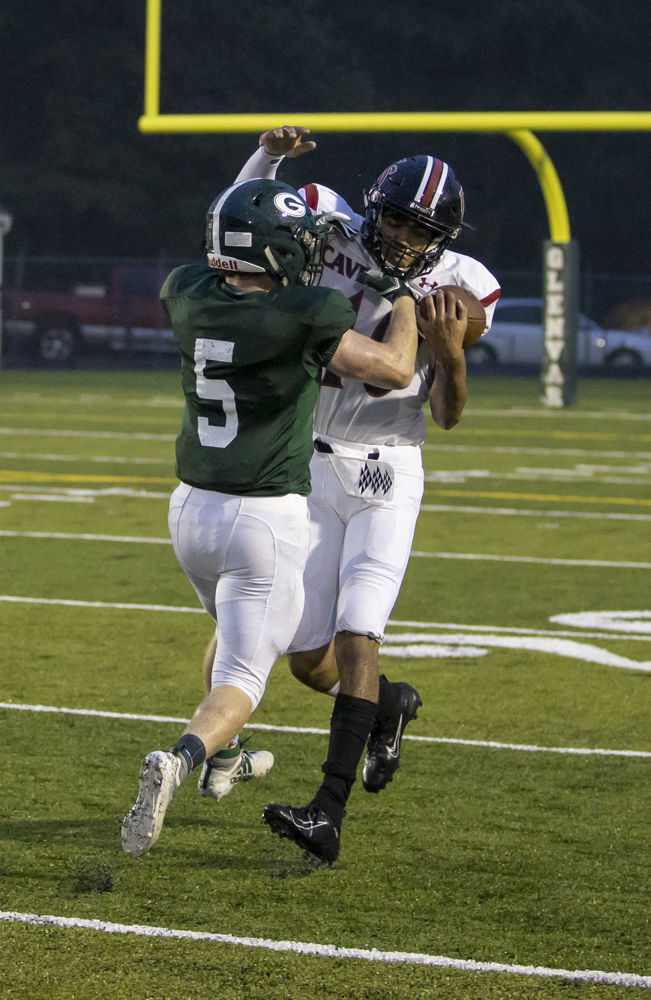 Cave Spring's (10) Ethan Coates catches a deep pass and breaks free for a touchdown. Glenvar's (5) Bradey Loder tries to break the pass up.